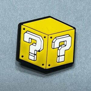 Super Mario mystery block croc charm.